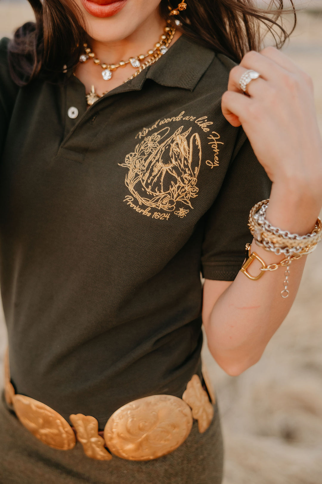 A model is wearing a sweet-as-honey polo available at Rodeo Quincy in Montana.